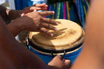 Canvas Print - Percussionist hands playing atabaque.