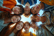 © feeling lucky - A circle of diverse young people looking down at the camera, showcasing friendship and multicultural unity.