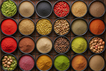 Grid Of Spices And Legumes In Circular Tins