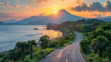 Fototapeta Natura - View of the seaside road at sunset with mountain in the background