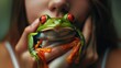 Little red-eyed frog in the girl's hand