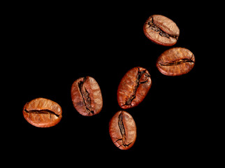 Wall Mural - Coffee beans isolated on black background. Close-up