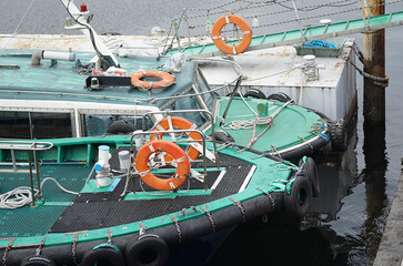 Two workboats moored at a pier in the port of Yokohama, Japan