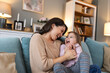 © Graphicroyalty - Happy mama with girl child, hug in home and weekend play time lifestyle for mom parent. Funny crazy kid in living room, mother holding toddler with smile and love bonding together on mothers day