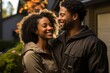 © Zireael - Joyful African American Couple Embracing Outside Their Home.