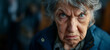 Frowning senior woman. Angry belligerent senior woman looking at the camera. portrait of a angry grandma. Senior grey-haired woman wearing casual clothes skeptic and nervous.
