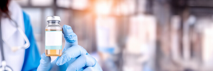 banner with doctor's hand holding a vaccine vial with white label mock-up for pharmaceutical ads, he