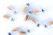 Vials, ampoules with dry probiotic, bifidobacteria inside on a white background, scattered chaotically. Copy space.