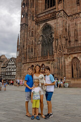 Wall Mural - Beautiful family with children, boys, visiting Strasbourg during summer vacation