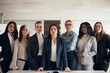 © Flamingo Images - Diverse group of focused businesswoman standing together in an office