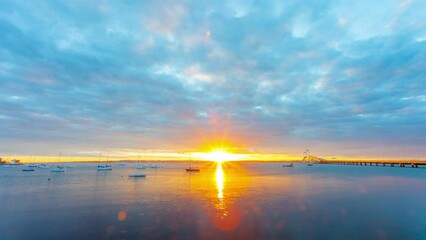 Wall Mural - Sunset Brilliance: Time-Lapse of Bridge and Moored Boats