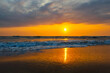 Sunrise sea sand beach in Danang,Vietnam.Inspire tropical beach seascape horizon. Orange and golden sunset sky calmness tranquil relaxing sunlight summer mood. Vacation travel holiday banner.
