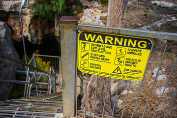 Wall Mural - Metallic stairs leading down to the Stick-Tomato Cave through a sinkhole in the Naracoorte Caves National Park in South Australia