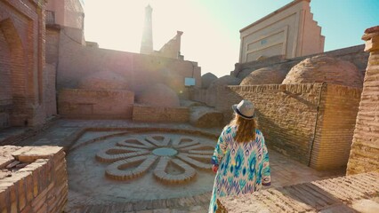 Wall Mural - Woman in ethnic dress at streets in Khiva