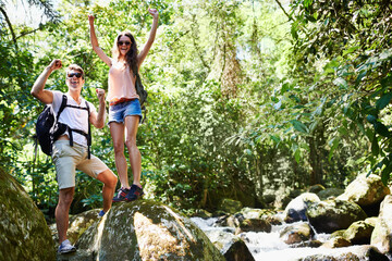 Wall Mural - Success, forest or happy couple celebrate in nature with goals on a trekking adventure. Freedom, smile or fun people excited by hiking in natural park or woods for exercise or wellness on holiday