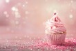 Delicate pink cupcake with glittering sprinkles, perfect for girl baby showers, birthday parties, or dessert marketing. Features ample space for custom text.