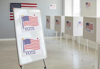 Wall Mural - Vote center with voting booths, adorned with American flags, stand in orderly rows. This snapshot captures the essence of civic duty and poll, symbolizing the presidential election process.