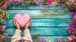 pink heart on wooden background