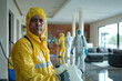 © AI_images - Professional Latin American janitors in uniform doing spring cleaning of modern house