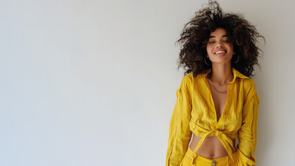 Wall Mural - Afro woman wearing yellow shirt smiling laugh out loud isolated on grey