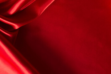 The bright red silk satin surface is beautiful and luxurious, wavy. For background and graphic work Blurry or blurry