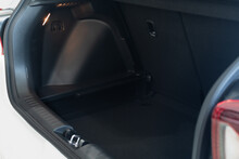 Luggage Compartment Of A Modern Vehicle Close-up With Light Lamp