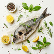Top down view of a raw dorado fish surrounded by herbs and lemon slices, ideal for culinary themes.