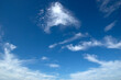 © Alekss - White fluffy clouds in the blue sky.