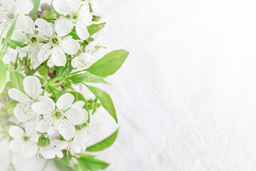 Wall Mural - Spring Easter background. Passover blooming white apple or cherry blossom on white wooden background. Happy Passover background. World environment day. Easter, Birthday, womens day holiday. Mock up.