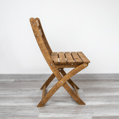 Folding wooden chair for a veranda