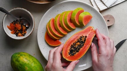 Wall Mural - Papaya fruit, sliced fresh papaya fruit with seeds