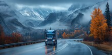 A blue semi truck with automotive lighting is descending a mountain road in the rain, navigating through water on the asphalt surface