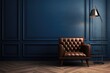 A mock up of a navy blue classic wainscoted wall with dark brown parquet floor, a golden lamp and a brown vintage leather armchair. Elegant interior background.