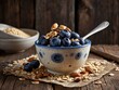 Blueberry and nut topped oatmeal on a rustic backdrop - oatmeal porridge Blueberry and nut. Nutritious oatmeal with fresh blueberries and nuts