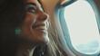 Caucasian woman sitting in airplane near window.
