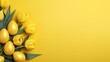 Yellow tulips and yellow eggs isolated on the yellow background, easter celebration concept