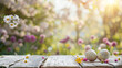 Easter eggs and spring flowers on a wooden table. Easter background