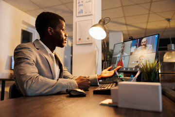 Executive manager explaining financial statistics report, discussing company strategy with remote team during online videocall meeting conferece. Coworkers working overhours in startup office