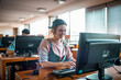 © Marko Geber - Female college student using computer at library
