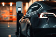 © ADDICTIVE STOCK - Electric car charging at a modern charge station Generative AI image