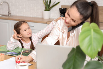 Poster - Working mother with her upset little daughter in kitchen