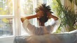 © Generative AI - Rear view of a woman relaxing sitting on a couch with the hands on the head and looking outdoors through the window of the livingroom at home : Generative AI