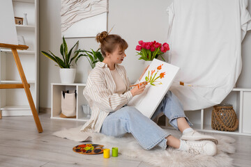 Poster - Female artist painting flowers on canvas in workshop