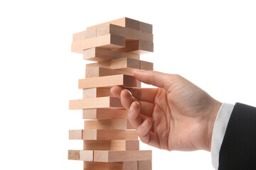 Wall Mural - Woman playing Jenga on white background, closeup