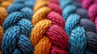 Macro image of colorful threads tightly woven together displaying the intricate texture of a historical tapestry and the precise skill required to create it.