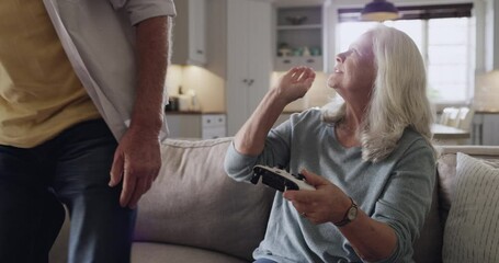 Poster - Home, senior couple and lose in video game competition, upset and man moody after gaming fail. Wife, problem and mature husband disappointed at defeat in gamer contest challenge on living room sofa