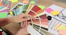 Female Hands Holding Color Palette In Office