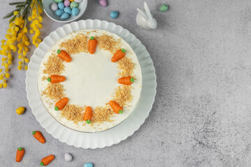 Wall Mural - Homemade Easter carrot cake made with walnuts, iced with cream cheese. Sweet dessert.