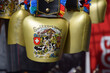 Bells in Switzerland touristic shop are typical symbol.Souvenir with picture of cows and Swiss flag
