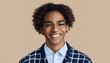Happy young African American gen z guy winking isolated on beige background. Playful ethnic teen student, cool curly generation z teenager smiling with white perfect teeth, close up portrait